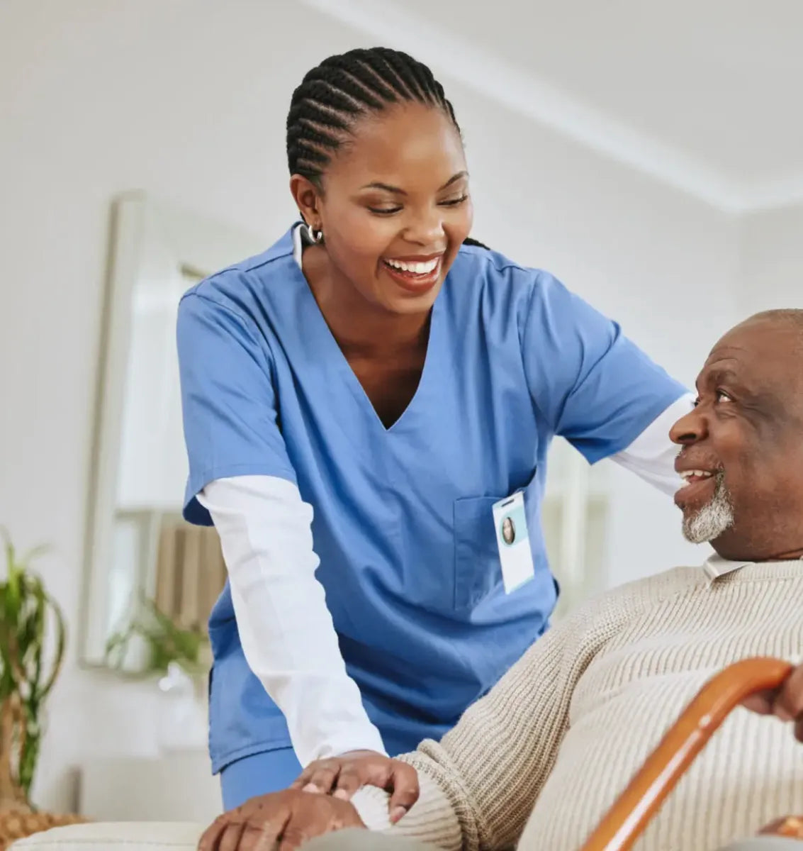 Nurse smiling with an older patient