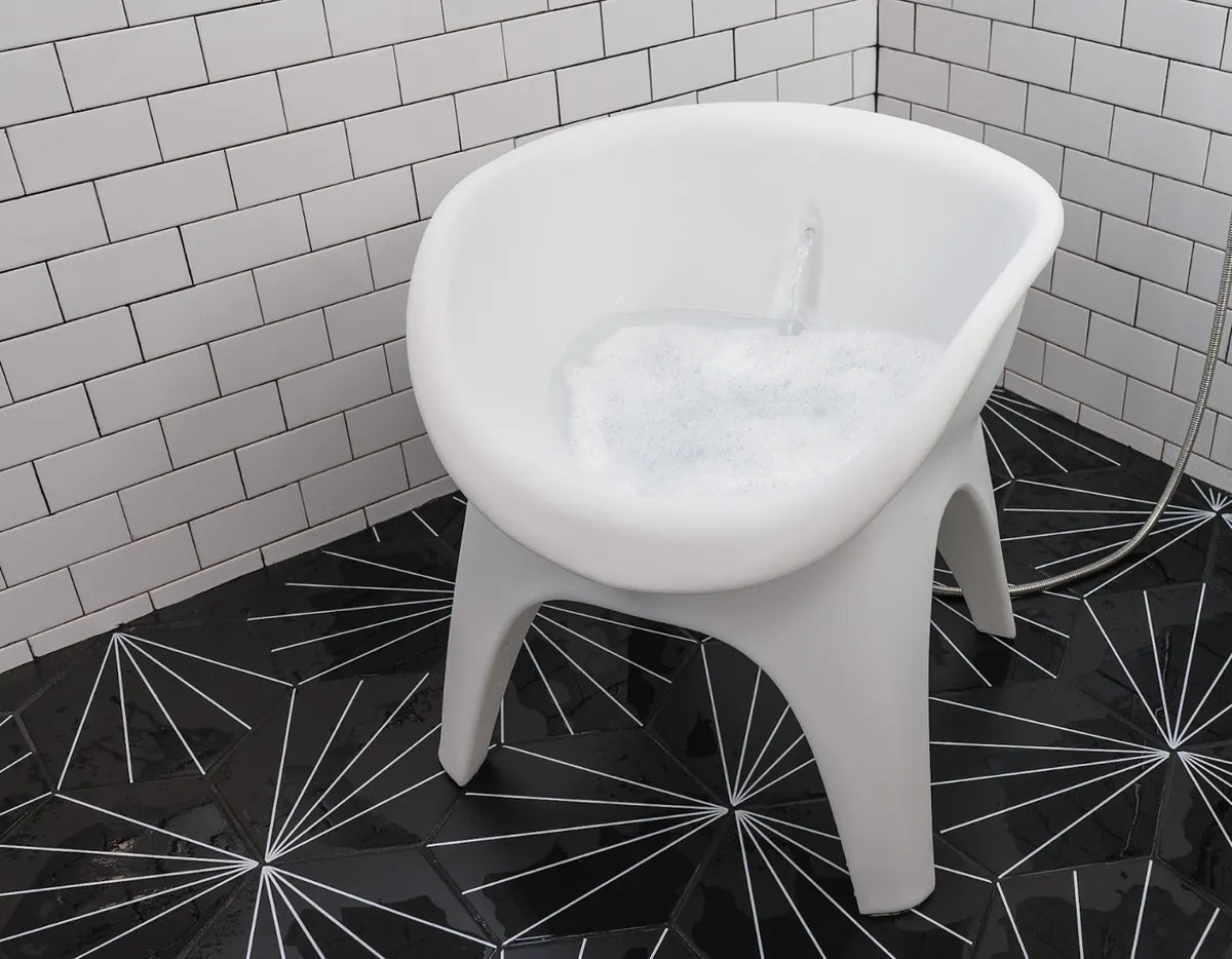 SoSoak basin filling with water in a tiled shower